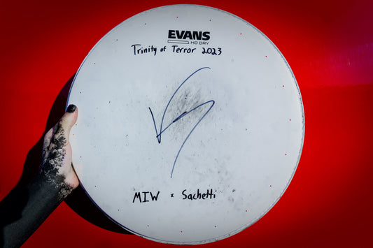 Pictured is a 14" snare drum head. Every head will say what tour they came from.